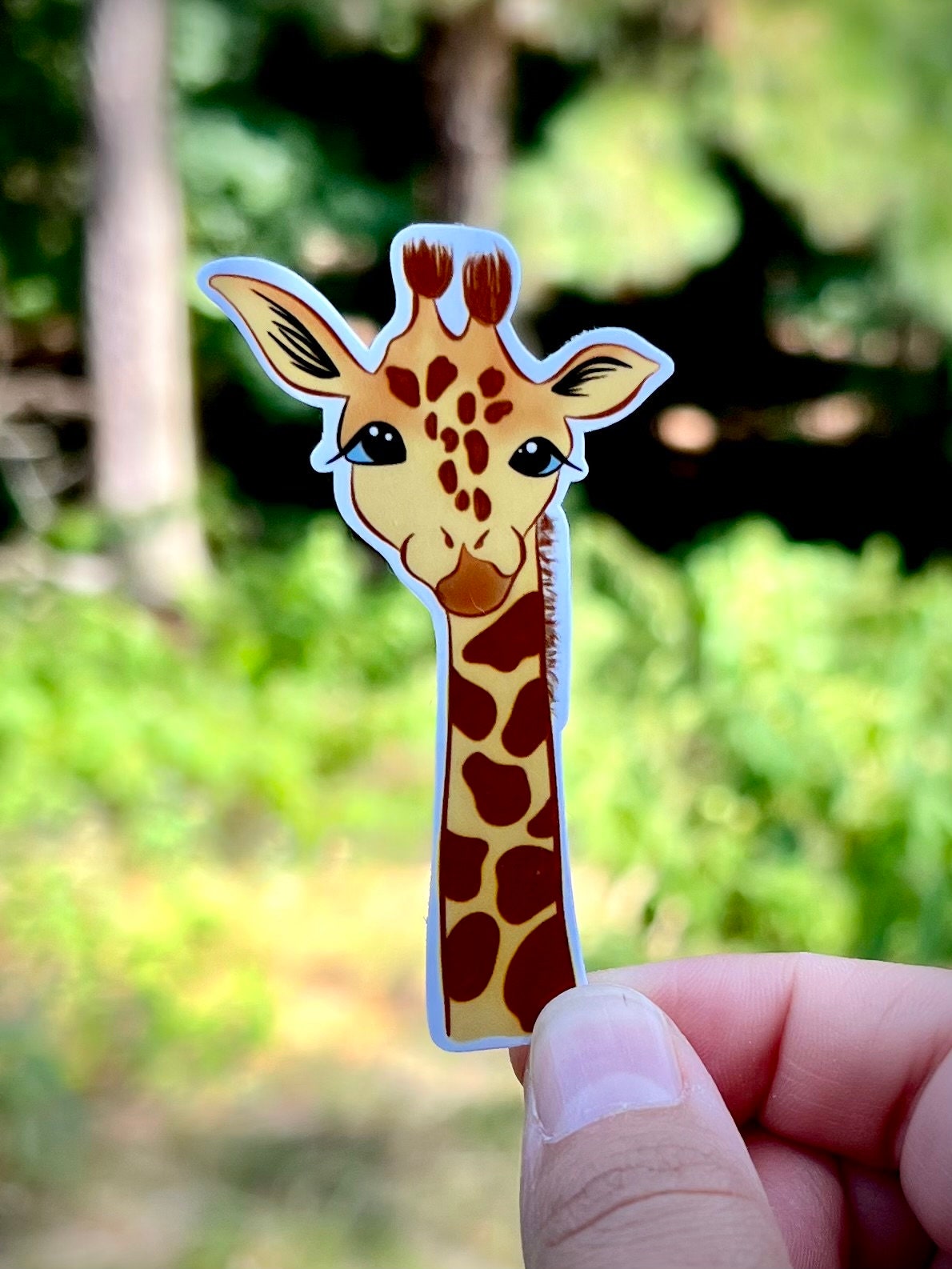 Cartoon giraffe vinyl sticker - waterproof decal for laptops, notebooks, tumblers, and more