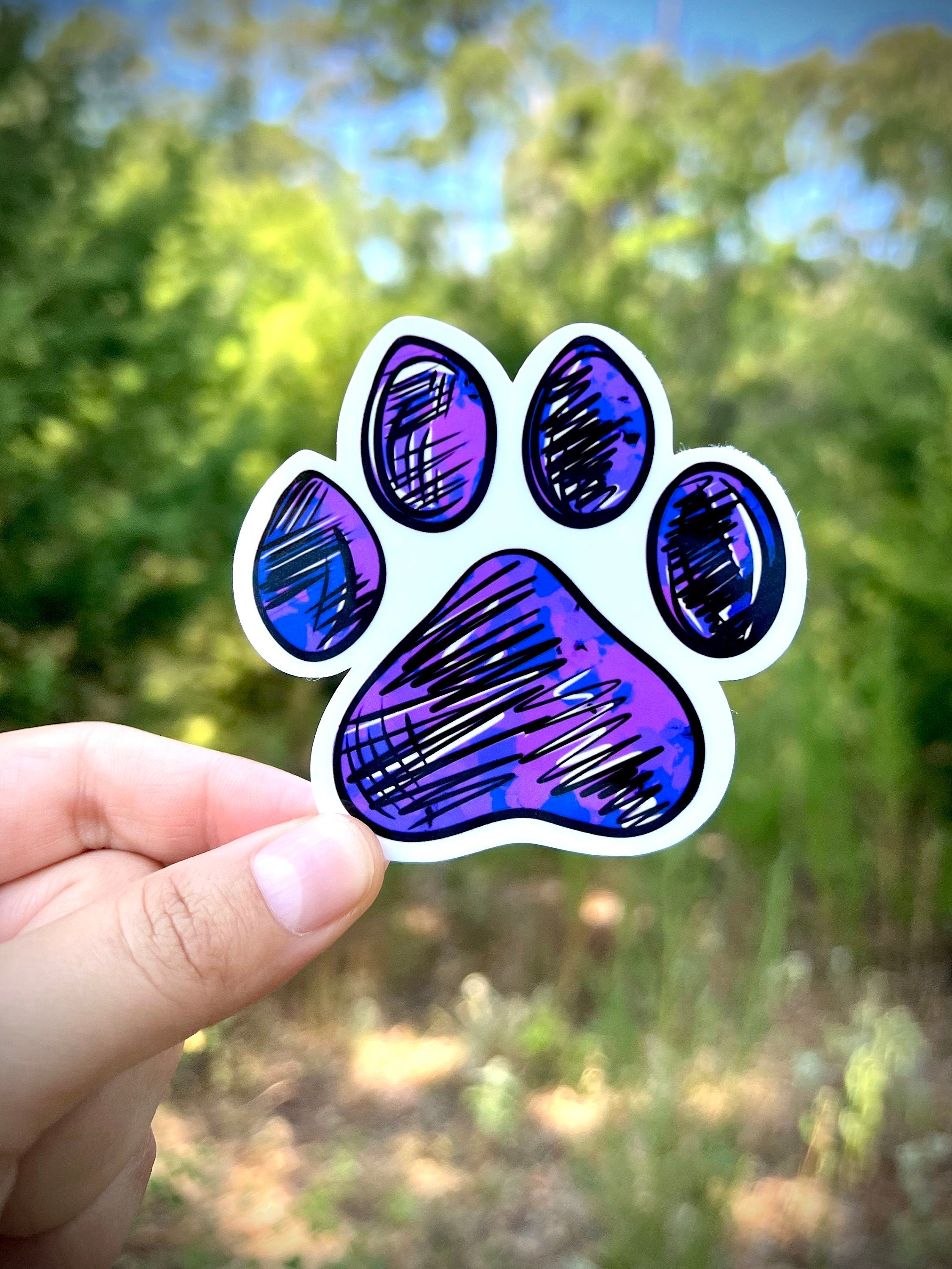 Paw print sticker in purple - waterproof vinyl decal for laptops, notebooks, tumblers, and more